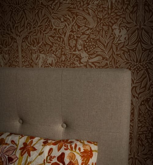 Close-up wallpaper and bed in the bedroom at InnerTrail Sweden