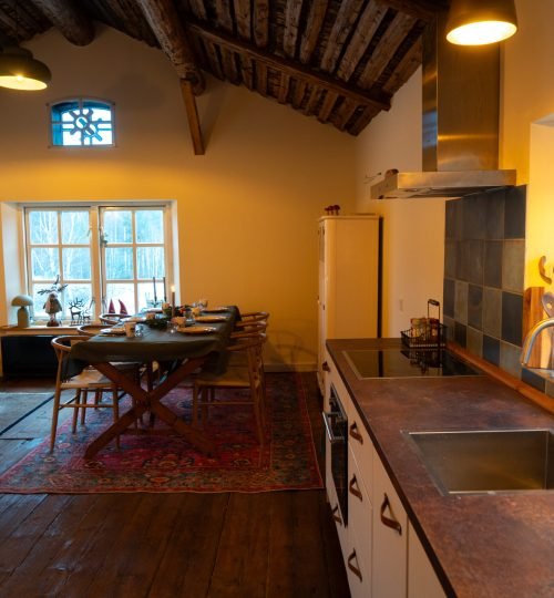 Kitchen and living room inside the guesthouse at InnerTrail Sweden